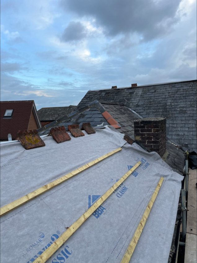 Roof being re-felted and battened